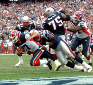 Patriots player Ty Warren tackles Buffalo Bills Quarterback J.P. Losman