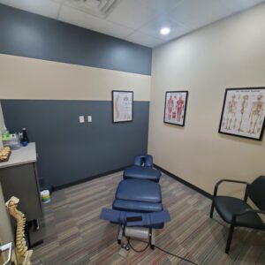 The inside of the Progressive Spine & Rehab Center office featuring a table for chiropractic care.